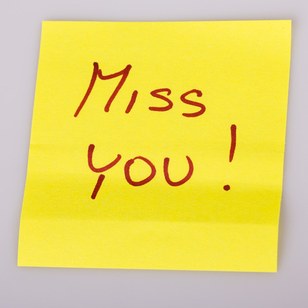 Yellow sticky note love letters isolated on whiteの写真素材