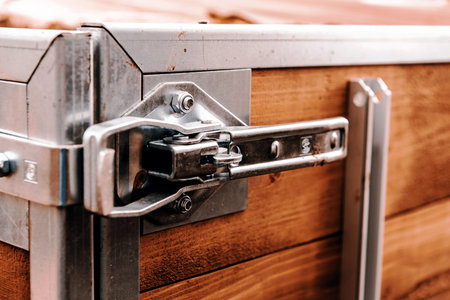 lock on the back of brown wooden trailer, transport and vehicleの写真素材