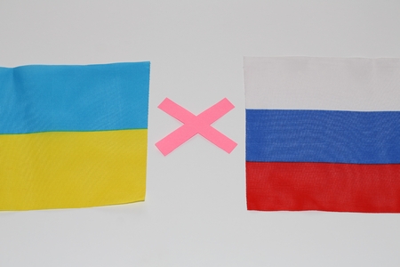 Ukraine and Russian flags symbolize coflict between two countriesの写真素材