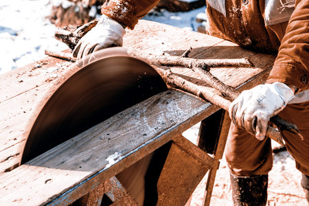 Man working with old handmade circular saw blade