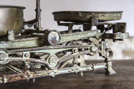 Old Antique weight measuring and kitchen goods weighing on the wooden tableの写真素材