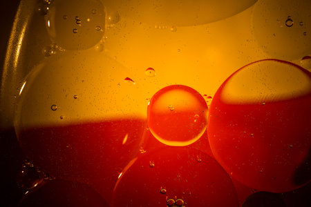 Oil drops on a water surface with color backgroundの写真素材