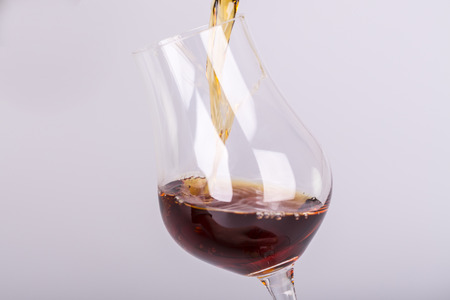 Beautiful cognac or rum on white backgroundの写真素材