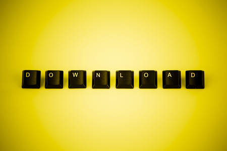 download word written with black computer buttons on yellow backgroundの写真素材
