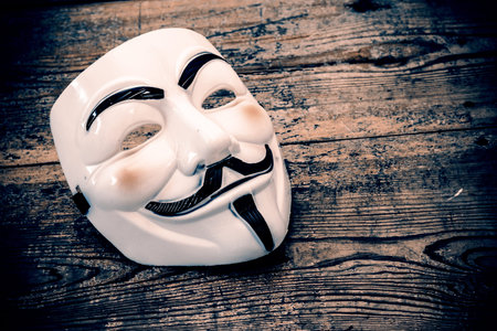 white anonymous mask on wood - retro styleのeditorial素材