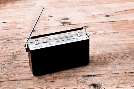Old radio on the wooden floorの写真素材