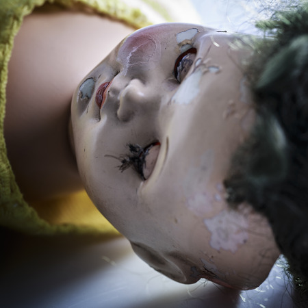 head of beatiful scary doll like from horror movie - evil face, grunge, macroの写真素材