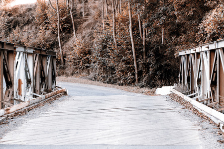 Beautiful old wooden bridge across the riverの写真素材