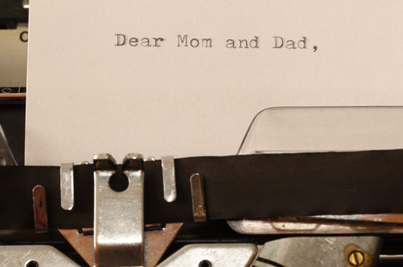 Letter with a title Dear Mom and Dad typed on old typewriter