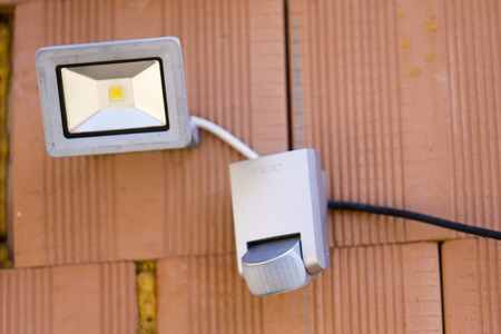 security led light with motion dectector or sensor on the wall of houseの写真素材