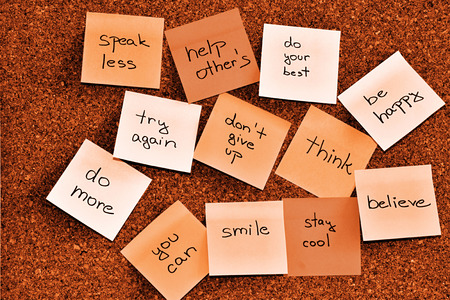 Notice cork board with many sticky note padsの写真素材