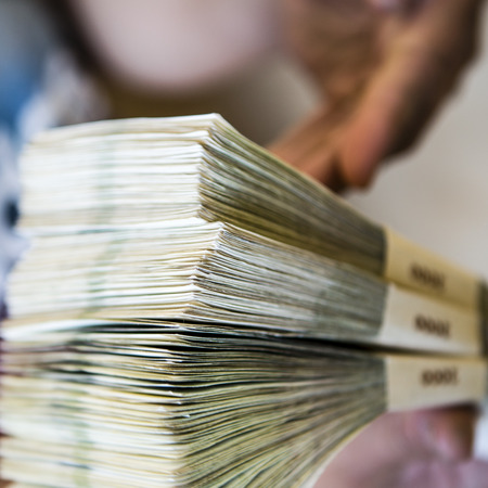 pack of money - big pile of banknotes in hand, czech crownの写真素材