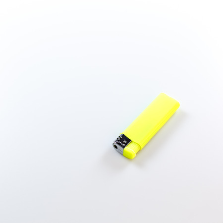yellow lighter on white backgroundの写真素材