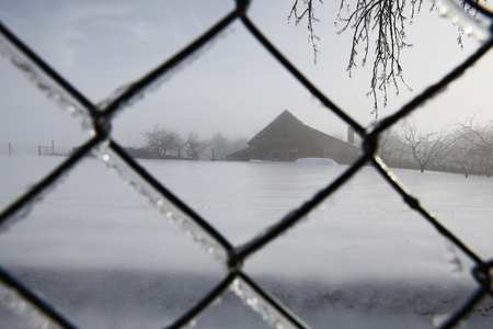 frozen fence in the true winterの写真素材