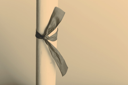 retro rolled paper on the old wooden tableの写真素材