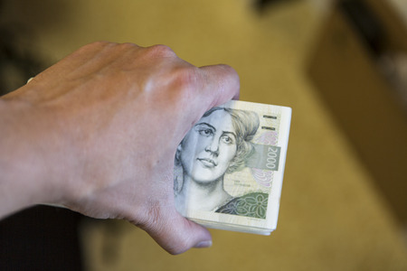 pack of money - big pile of banknotes in hand, czech crownの写真素材