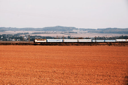 Train with wagons and field