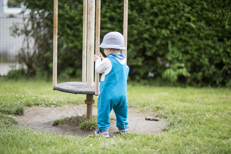 happy little boy on playgroundの写真素材
