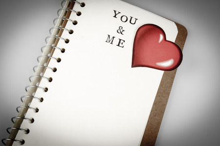 you and me text in emty book or diary on white. valentine day conceptの写真素材