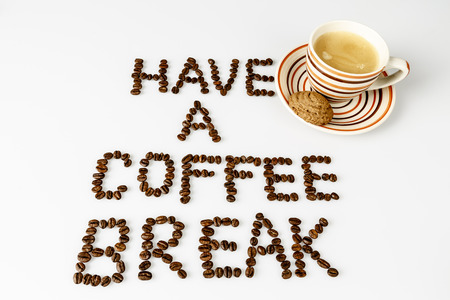text have a coffee break from beans on white with cup of coffee and cookie or biscuit の写真素材