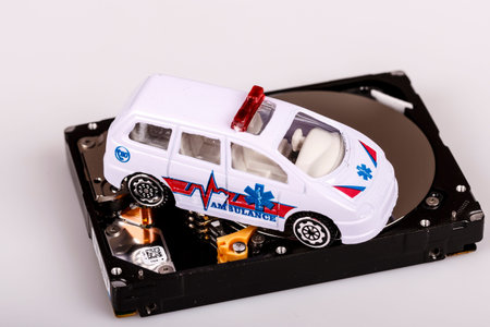 ambulance car on harddrive or hdd - data backup, safe and rescue concept