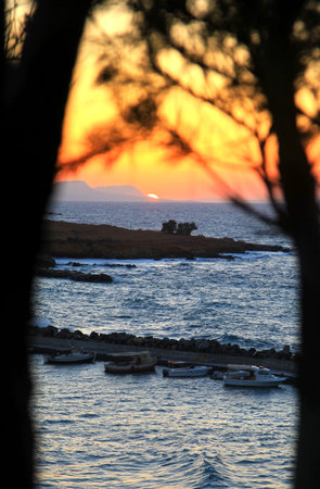PANORMO, GREECE - SEPTEMBER 9  Sunset at small seaside village Panormo at island Crete on September 9, 2013 in Panormoのeditorial素材