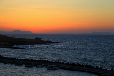 PANORMO, GREECE - SEPTEMBER 9  Sunset at small seaside village Panormo at island Crete on September 9, 2013 in Panormoのeditorial素材