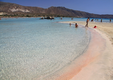 ELAFONISI, GREECE - SEPTEMBER 10: Shallow clear sea with pink sand at Elafonisi (Crete) on September 10, 2013 in Elafonisiのeditorial素材