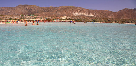 ELAFONISI, GREECE - SEPTEMBER 10: Shallow clear sea with pink sand at Elafonisi (Crete) on September 10, 2013 in Elafonisiのeditorial素材