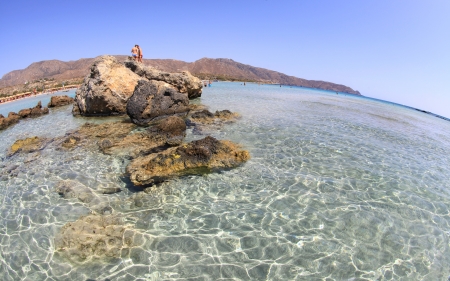 ELAFONISI, GREECE - SEPTEMBER 10: Shallow clear sea with pink sand at Elafonisi (Crete) on September 10, 2013 in Elafonisiのeditorial素材