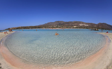 ELAFONISI, GREECE - SEPTEMBER 10: Shallow clear sea with pink sand at Elafonisi (Crete) on September 10, 2013 in Elafonisiのeditorial素材