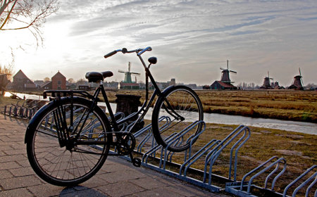 Windmills and bike in Zaanse Schans museum, Netherlandsの写真素材