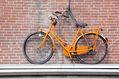 DELFT, NETHERLANDS - APRIL 2: Bicycle on the house in town Delft on April 2, 2014 in Delftのeditorial素材