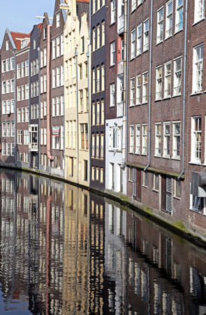 Water canal and typical architecture in city Amsterdam on April 3, 2014 in Amsterdamの写真素材