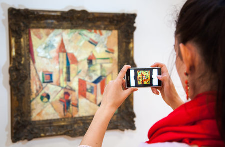 RUZOMBEROK, SLOVAKIA - JULY 22: Girl looking at Fulla's painting in Gallery of Ludovit Fulla on July...