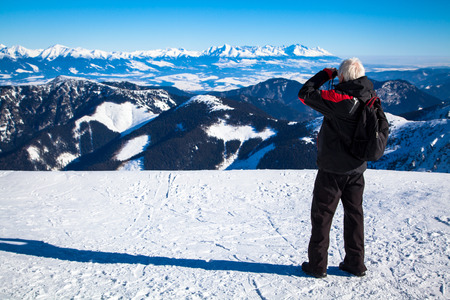 Men with binoculars on hill CHopok, Slovakiaの写真素材