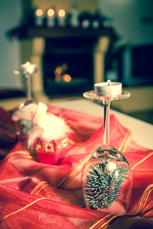 Candles and fireplace in cottageの写真素材