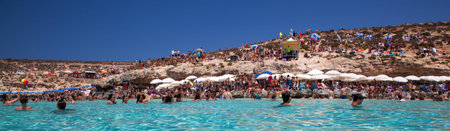 COMINO, MALTA - JULY 16: Sunbathing at  Blue lagoon at island Comino - Malta on July 16, 2015 in Cominoのeditorial素材
