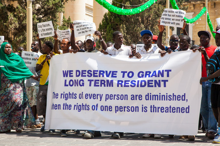 VALLETTA, MALTA - JULY 17: Immigrants protest in Valletta on July 17, 2015 in Vallettaのeditorial素材