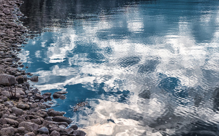 Reflection on water reservoir CIERNY VAH, Slovakiaの写真素材