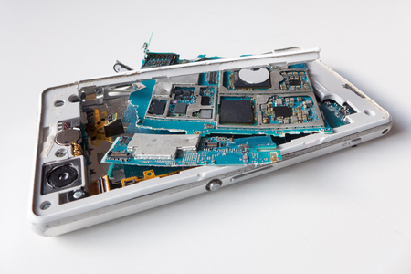 Isolated broken smartphone - close upの写真素材