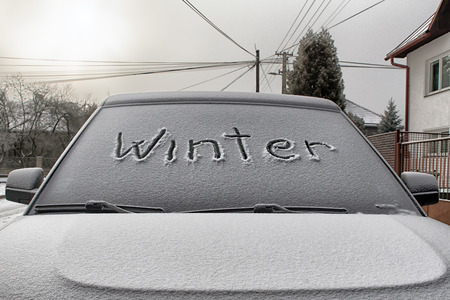 Text WINTER on windshield of carの写真素材