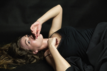 Lying pretty woman with beautiful faceの写真素材