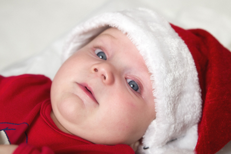 Smiling baby with Santa capの写真素材