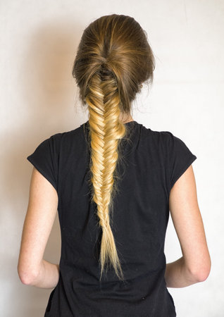 Girl with long blonde plait