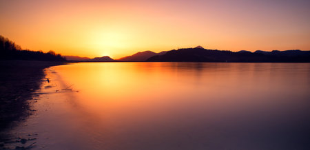 Beautiful sunrise on lake Liptovska Mara, Slovakia. Long exposure shot with ND filterの写真素材