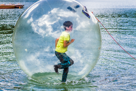 Aquazorbing. Aqua zorbing on water.の写真素材