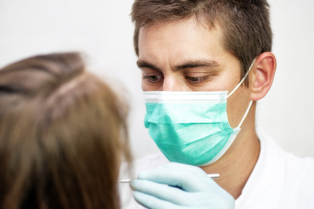 Dentist and patient at surgeryの写真素材