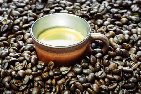 isolated cup of coffee and beans on white backroundの写真素材