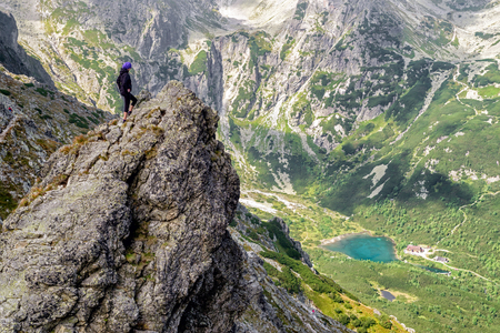 Hiker woman on the rock at High tatras mountains in Slovakia. Mountainscape.の写真素材